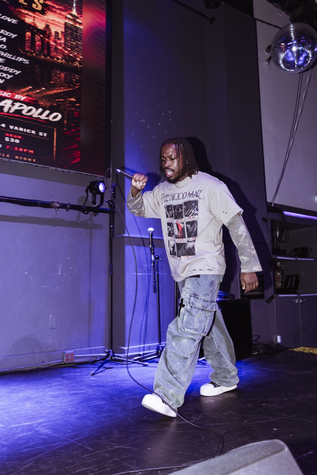 Young Moddy performing into a microphone